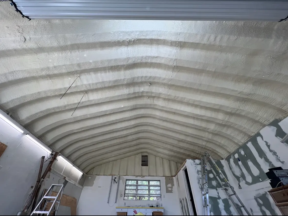 Spray polyurethane foam applied to the underside of a metal roof deck in Lubbock